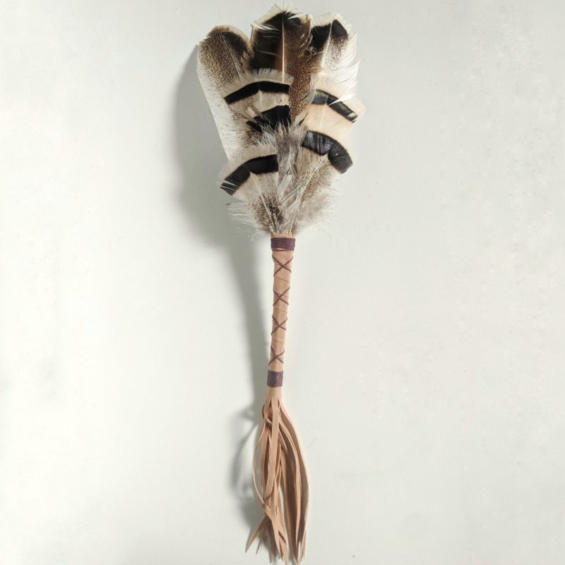 Smudging turkey feather